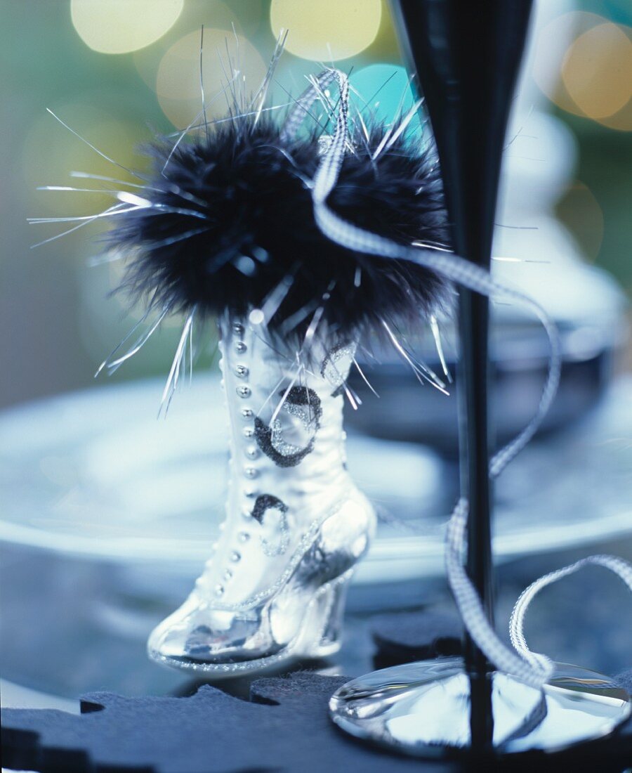 Christmas table decoration with silver boot & feather boa