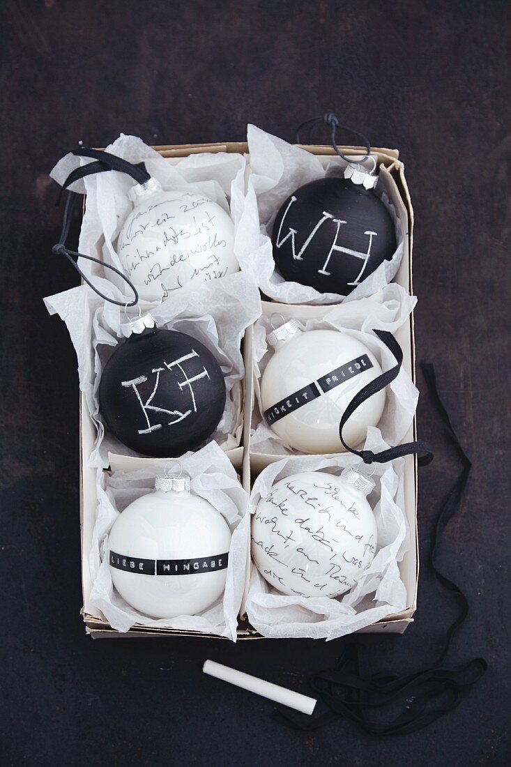 Poems on black-and-white Christmas tree baubles