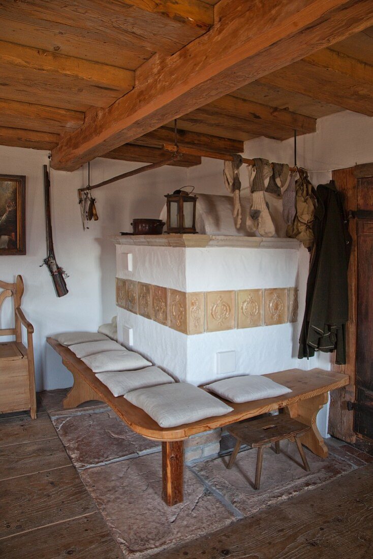 Tiled stove with bench in historical farmhouse