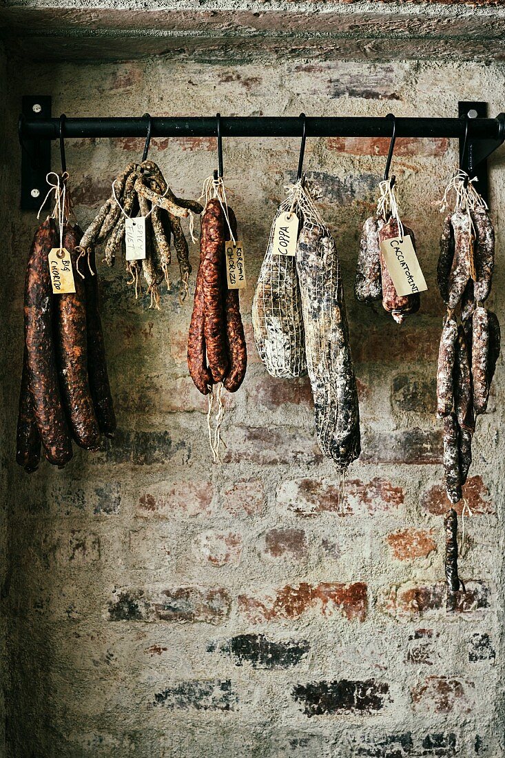 Various types of sausages hanging from butchers' hooks, South Africa