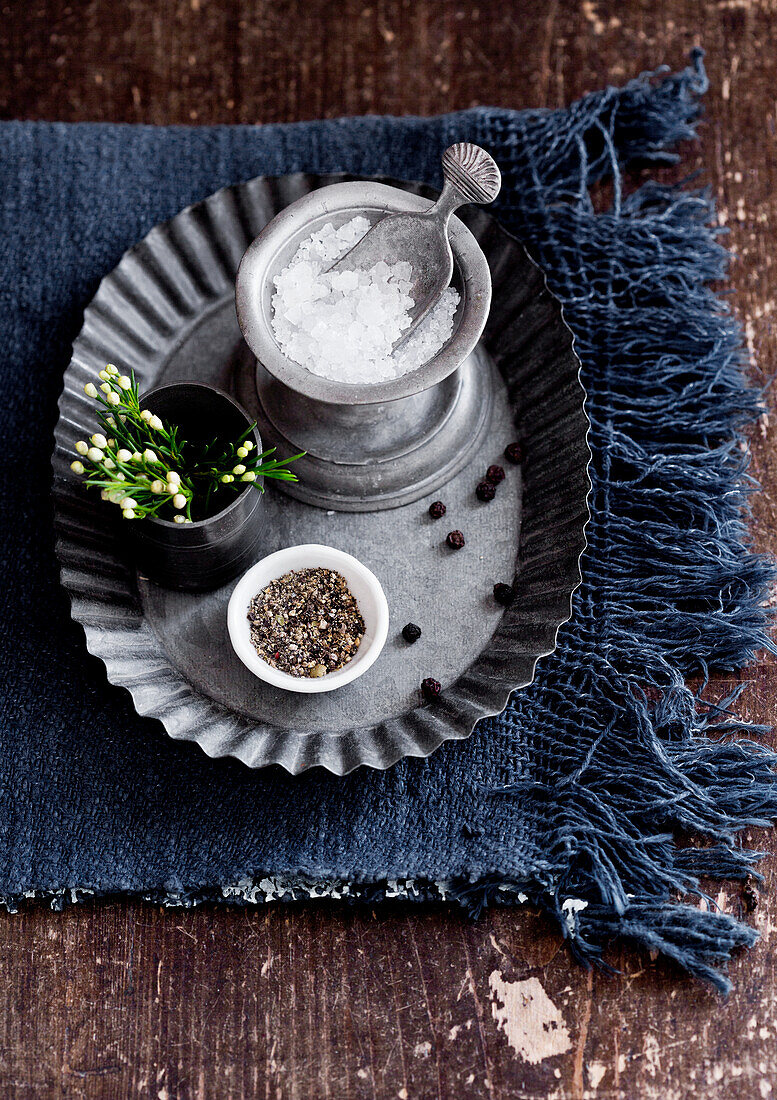 Candlestick used as salt cellar on flan tin used as tray