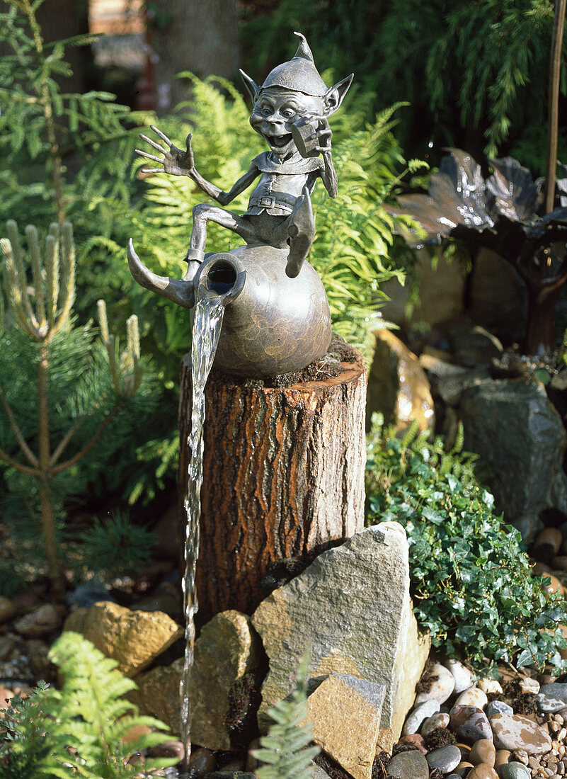 Water feature, Garden Gnome sitting on amphora