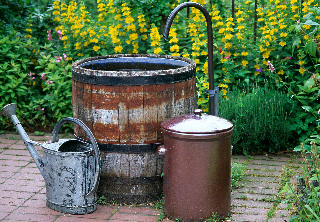Wooden barrel with curved water inlet as fountain