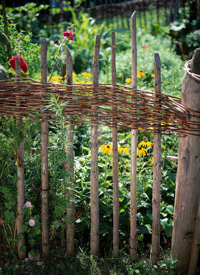 Wooden wicker fence for the cottage garden