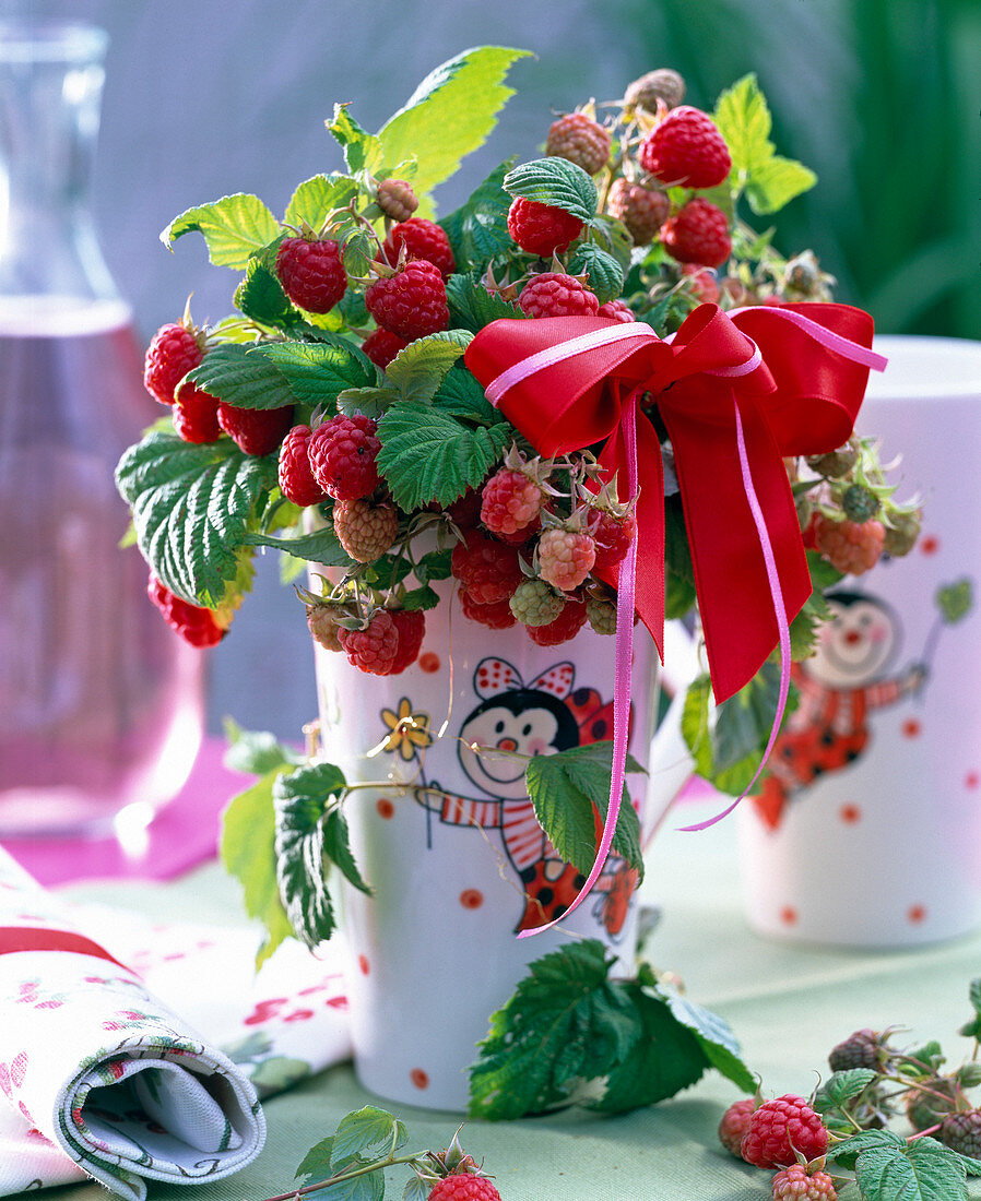 Rubus (raspberry) in lucky beetle vase