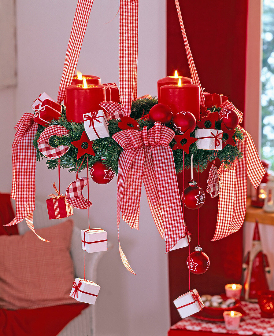 Hanging Christmas wreath with red candles