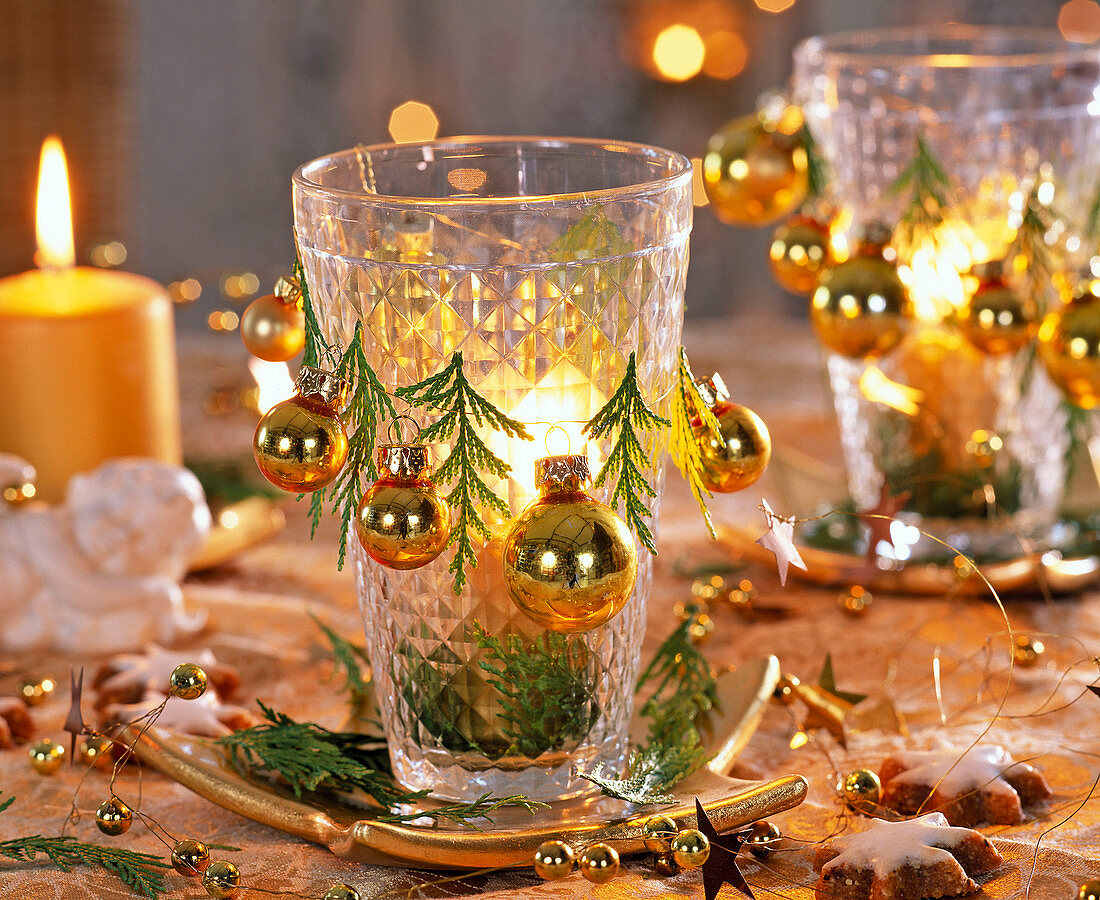 Glasses as lanterns decorated with golden balls