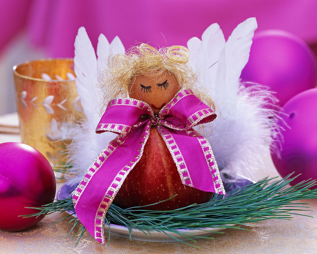 Malus, Pinus, angel figurine made of apple, wooden ball