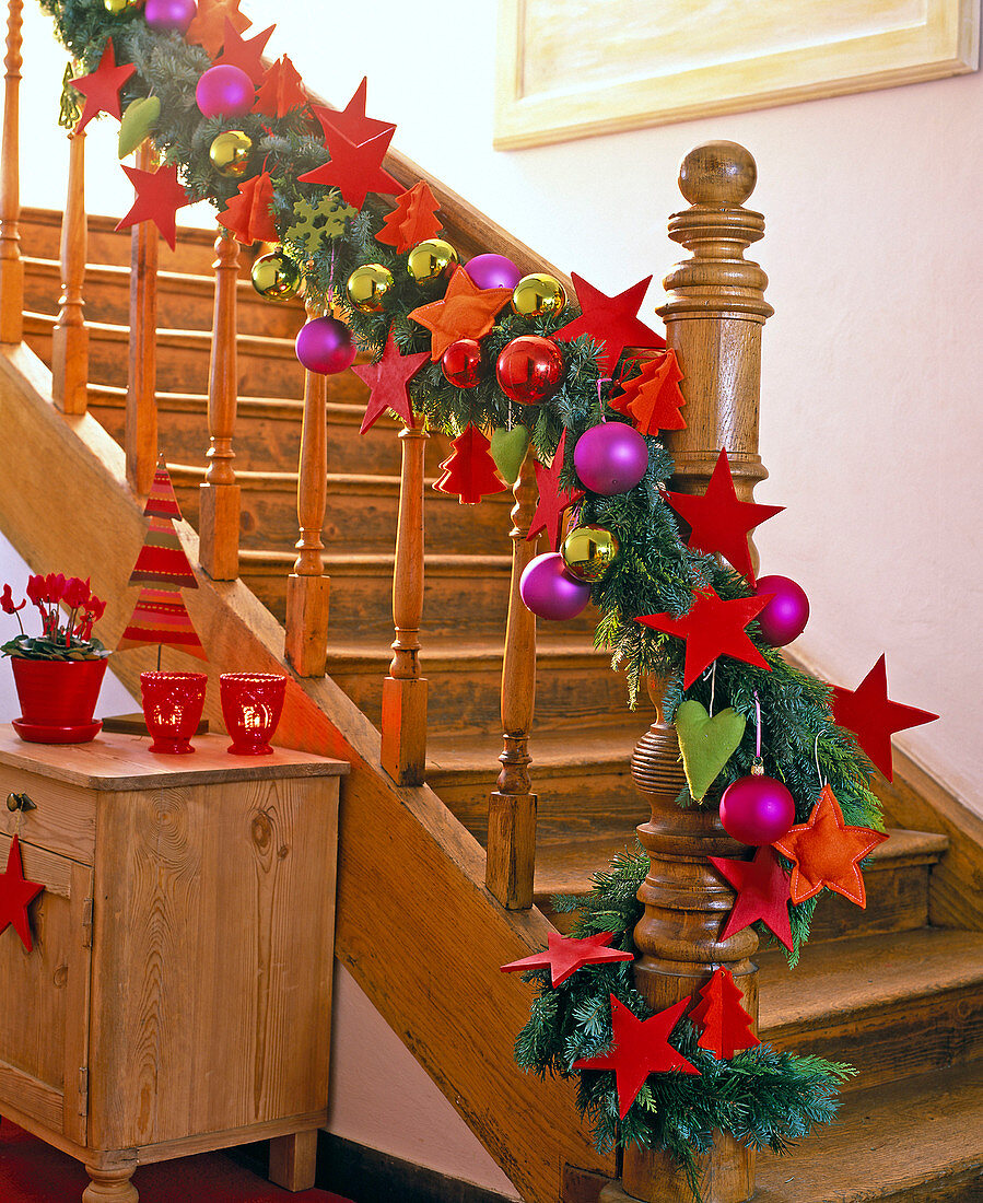 Garland of mixed green on stair rails