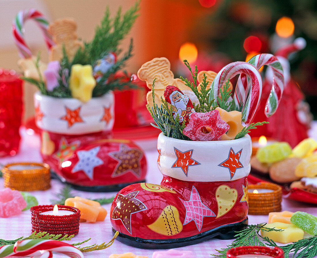 Colorful Santa Claus boots made of porcelain, filled with Chamaecyparis