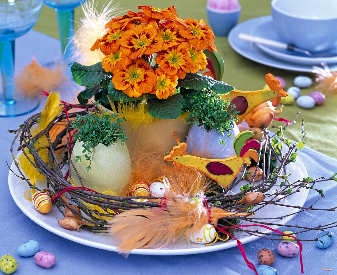 Easter, primula acaulis, ceramic eggs with cress
