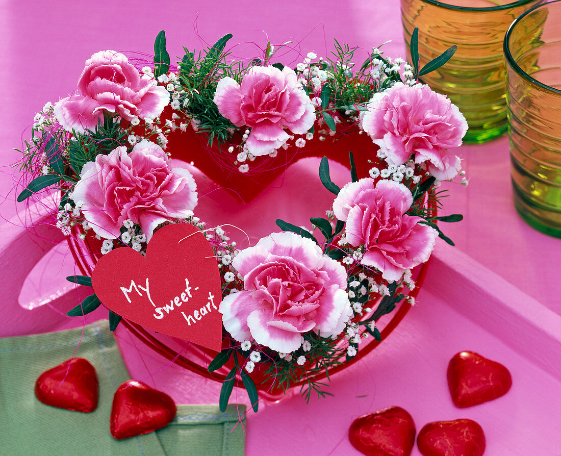 Oasis heart with pink and white carnations