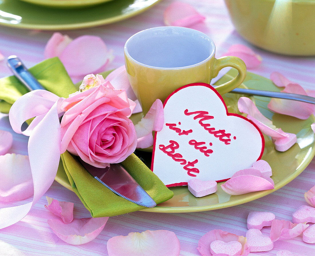 Rose on green napkin, green place setting, heart with text