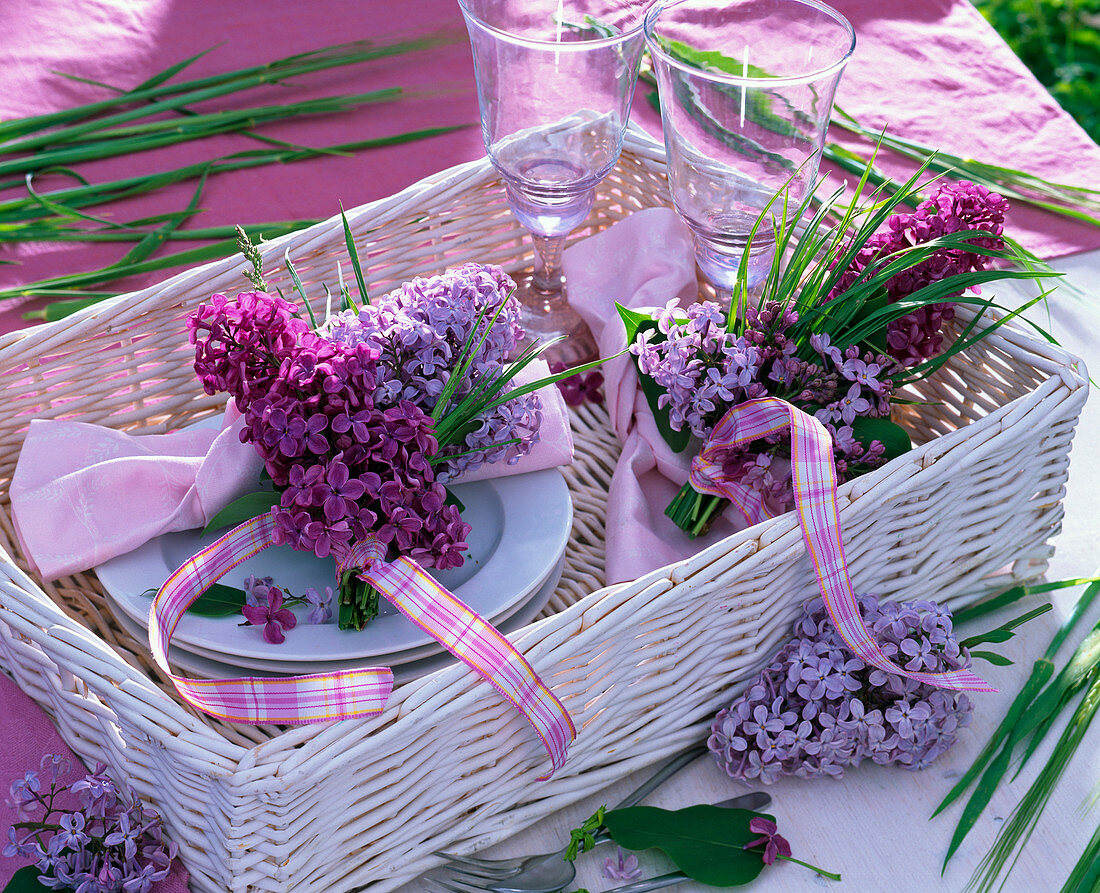 Small bouquets made of Syringa vulgaris (lilac) and grasses