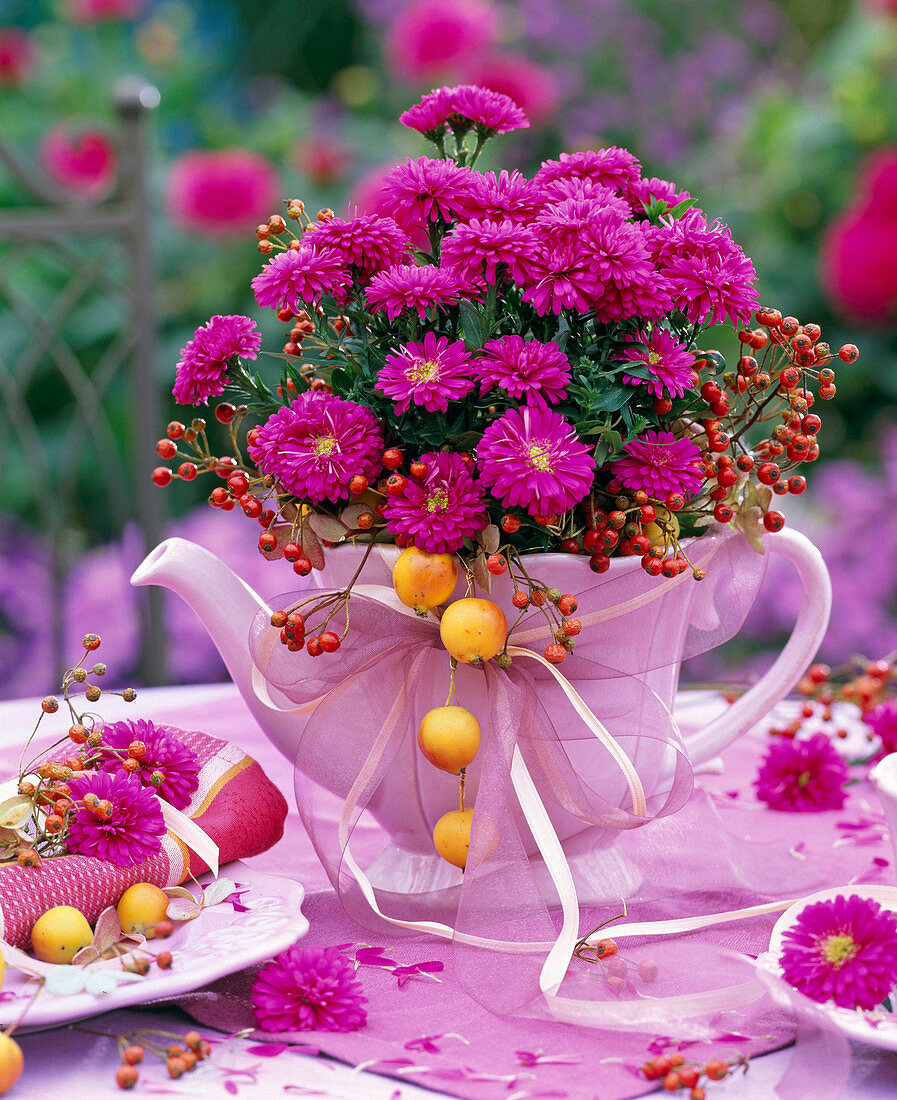 Autumn bouquet with asters in pink jug