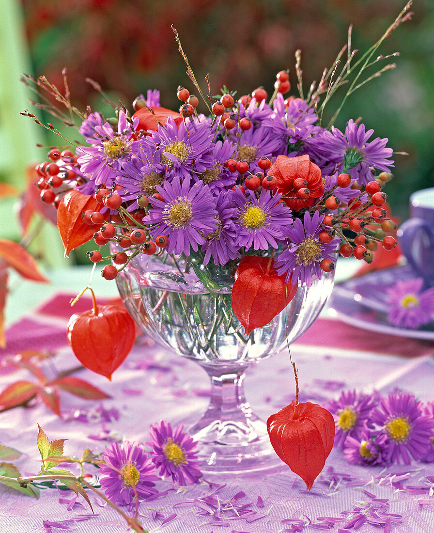 Asters with berries and fruits bouquet
