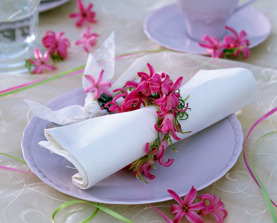 Napkin ring made of Hyacinthus flowers around white napkin