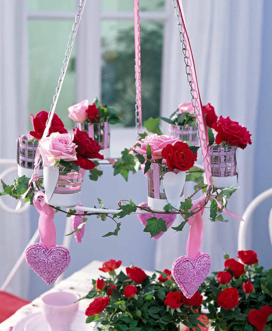 Hanging metal wreath with pink (rose), Hedera (ivy) tendril
