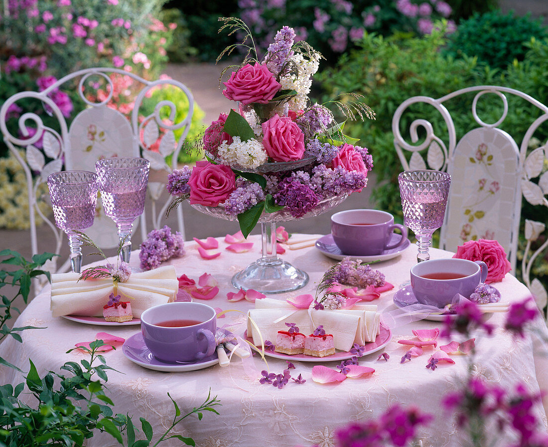 Etagere with pink and syringa on covered tea table