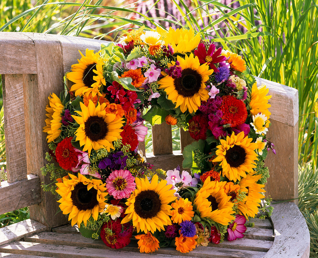 Wreath made of Helianthus (sunflower), Zinnia (Zinnia), Ageratum