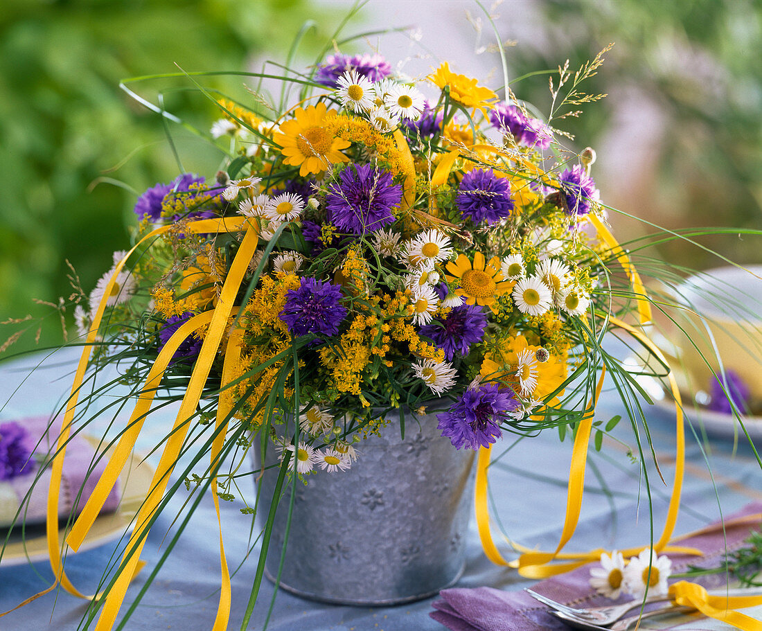 Bouquet of Centaurea (cornflower), Solidago (goldenrod), Erigeron