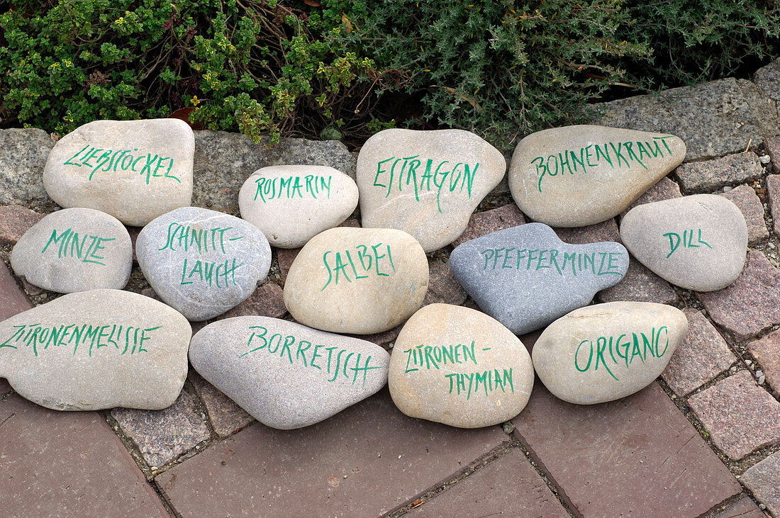 Written stones as labels for herbal bed