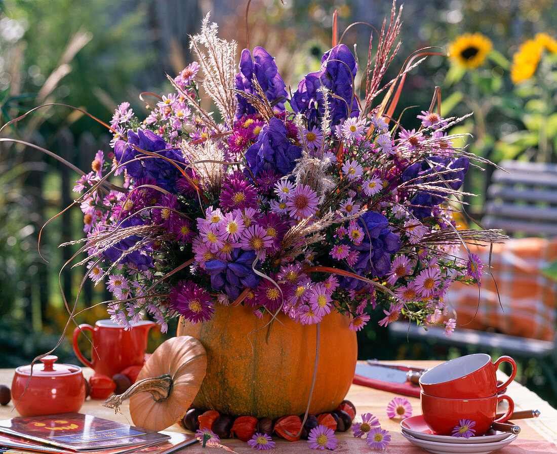 Purple autumn bouquet in pumpkin vase