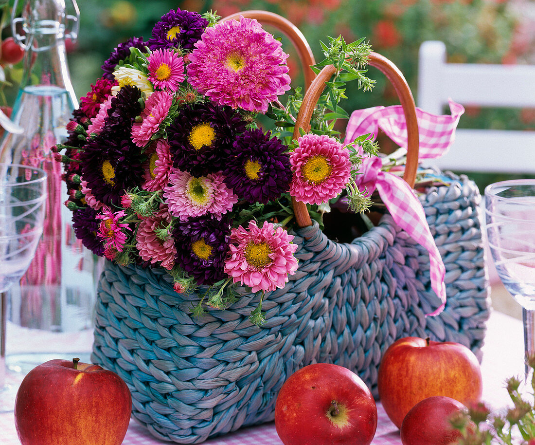 Bouquet of callistephus (China aster) in bag, malus (apple)