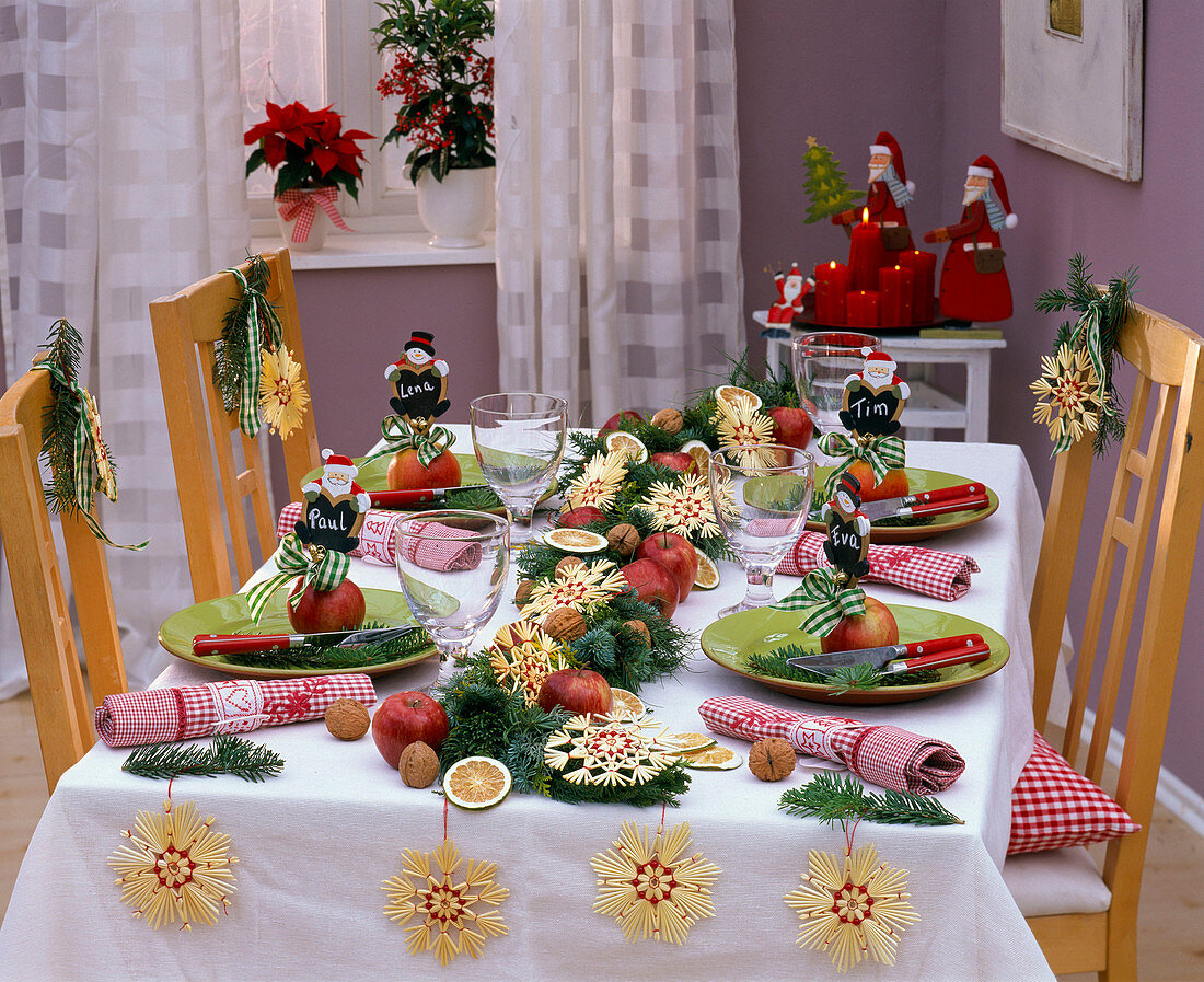 Christmas table decoration with mixed coniferous garland