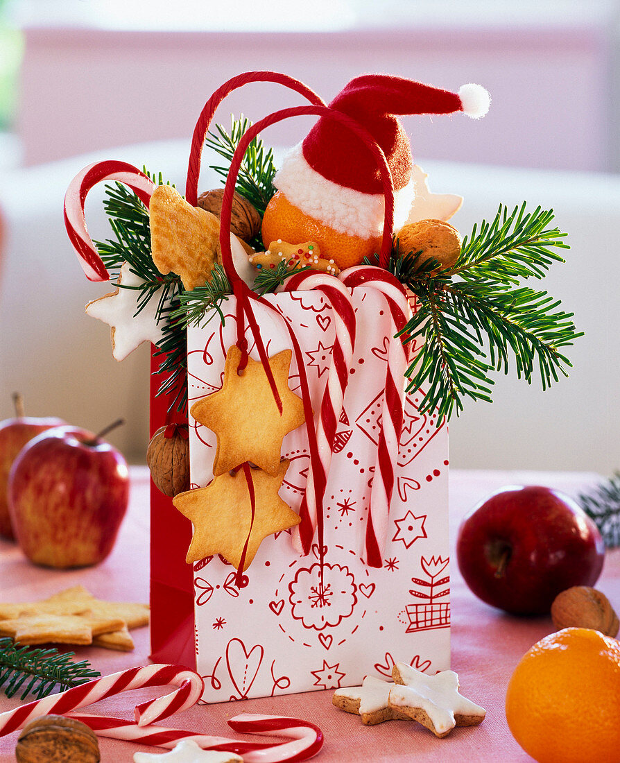St. Nicholas bag with cookies, candy canes, tangerine