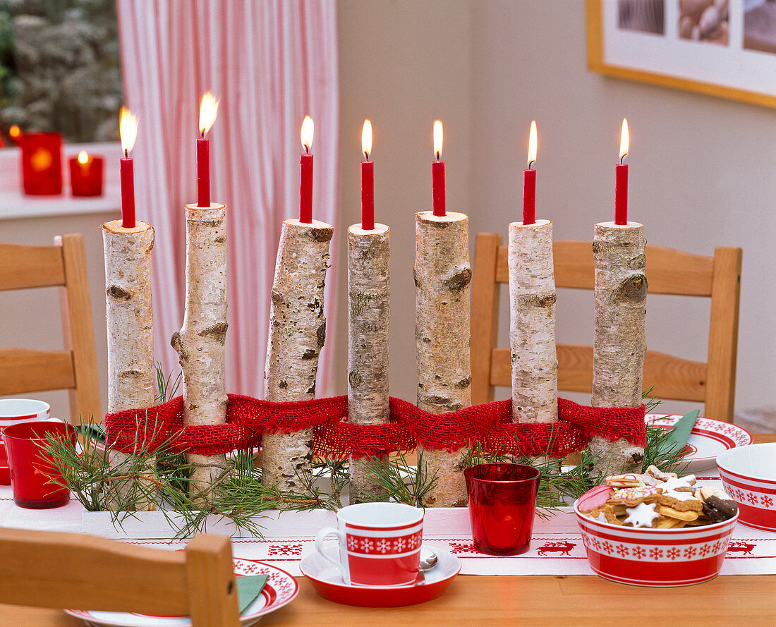 Betula branches as candlestick, tied with ribbon, pinus