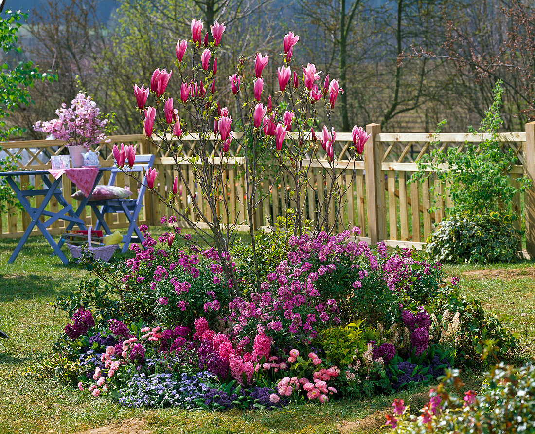 Round flower bed in the small garden