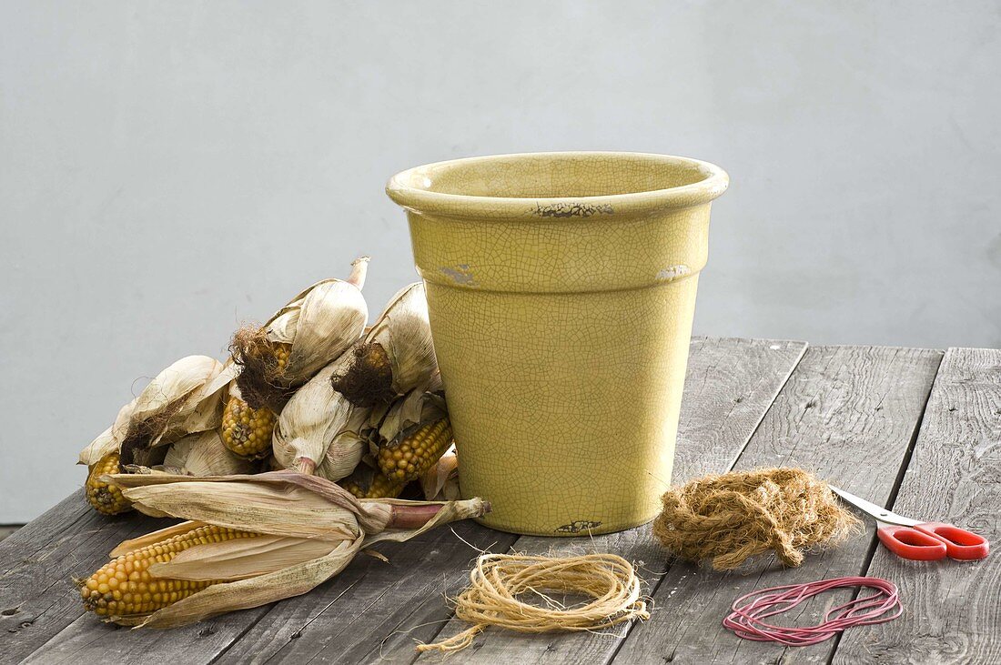 Bucket decorated with corncobs