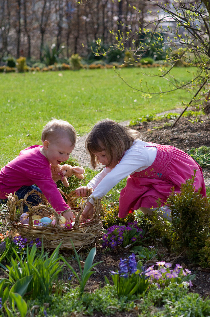 Children with Easter basket in the garden