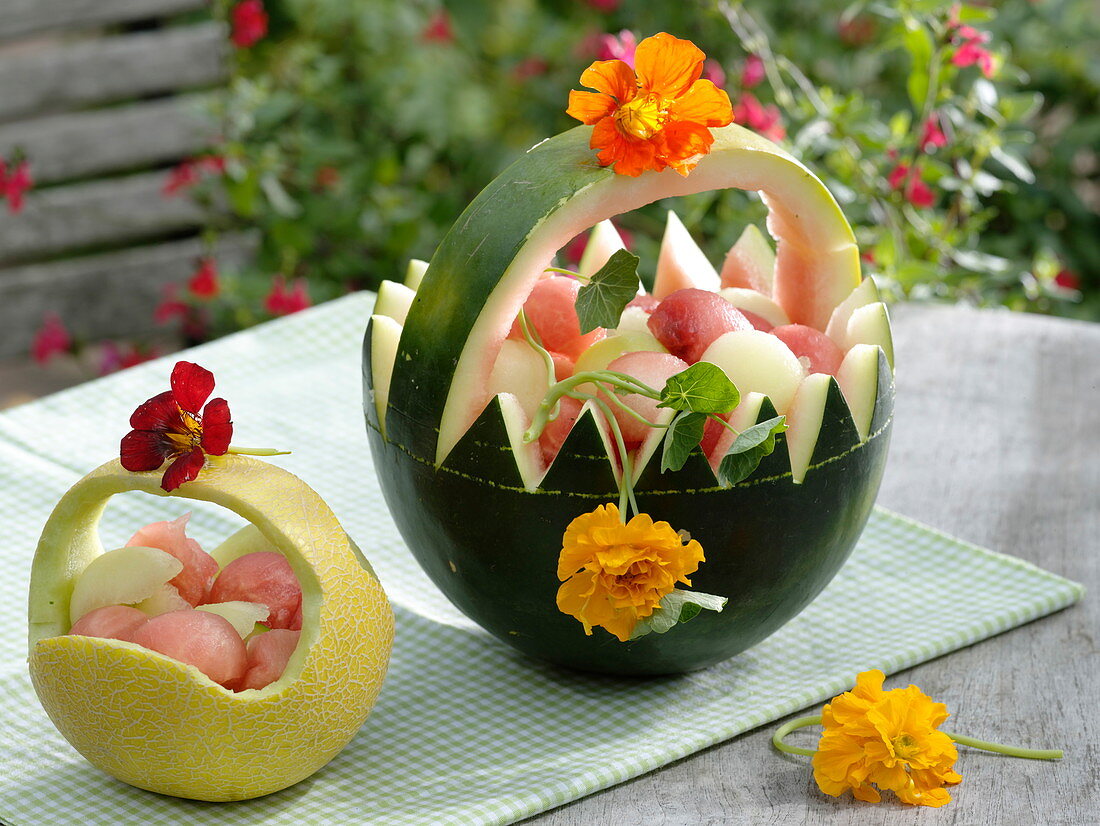Melons carved as baskets for fruit salad
