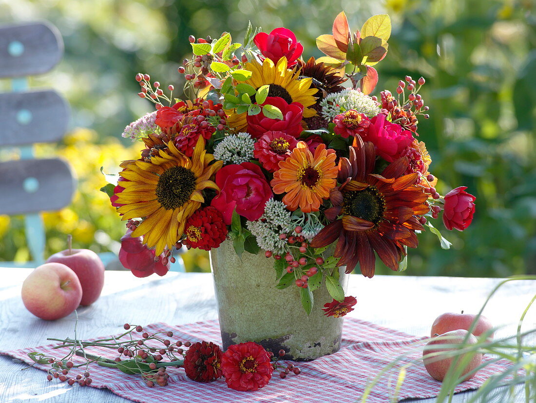 Red-orange late summer bouquet with sunflowers