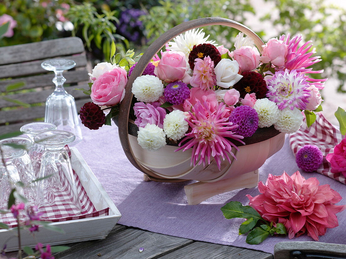 English chip basket filled with dahlias and roses