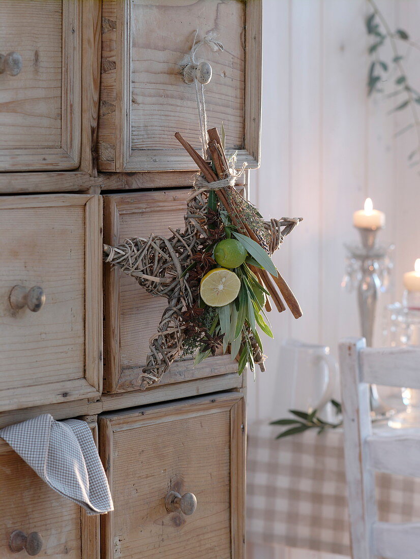 Scented star made of branches, decorated with lemon and lime