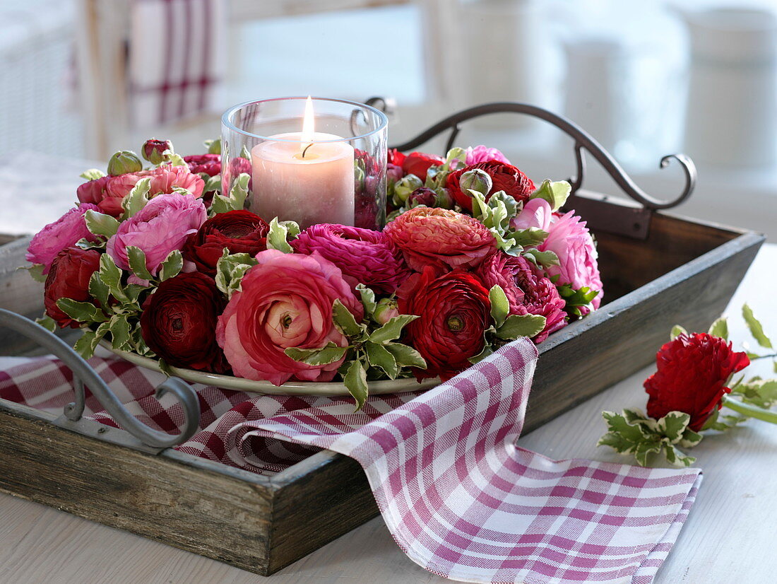 Ranunculus wreath on wooden tray