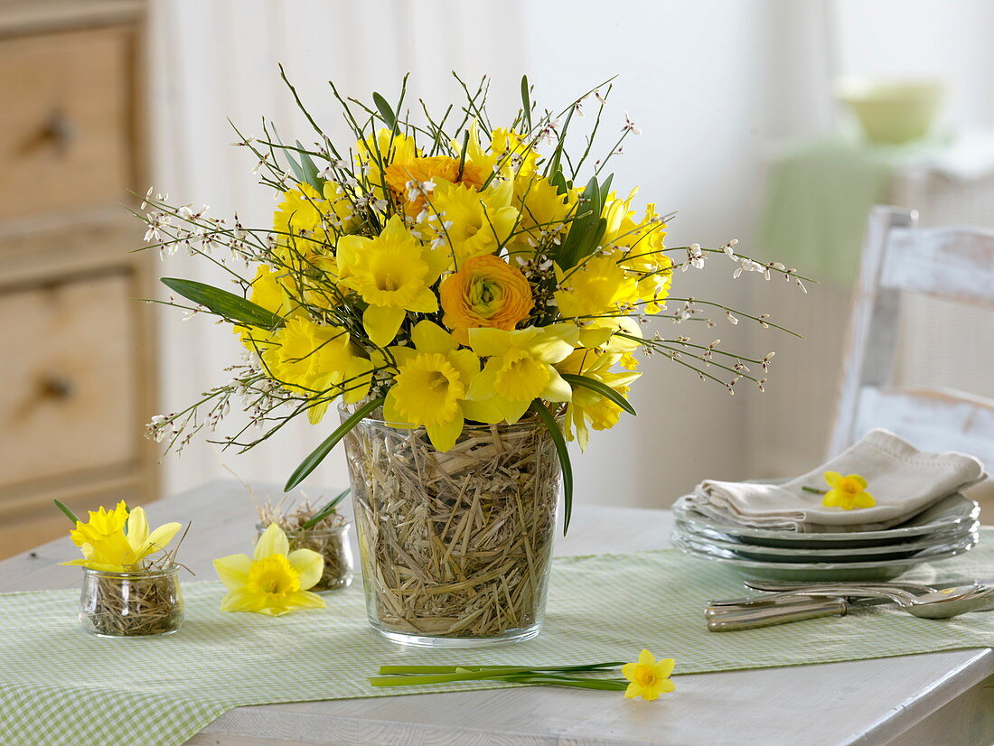 Yellow spring bouquet in straw vase