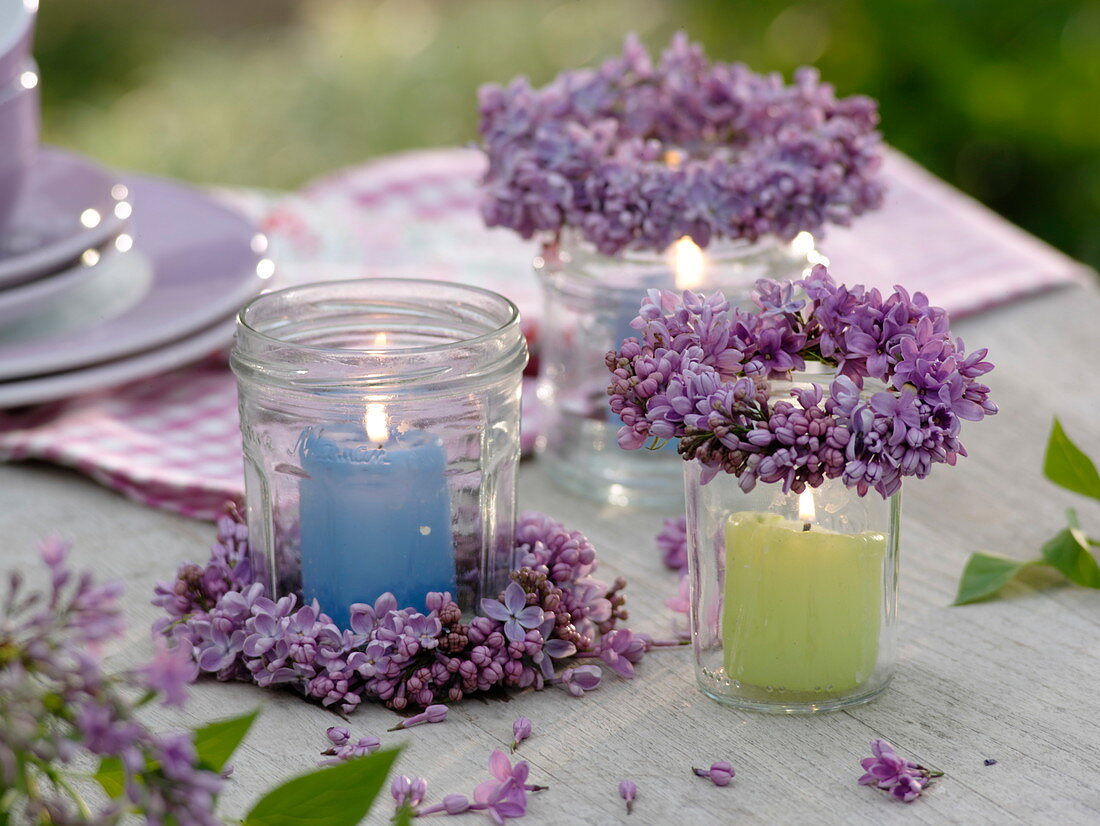Lantern from screw cap jars with candles and Syringa wreaths