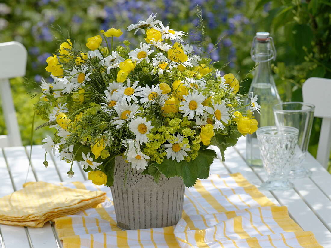Yellow-white early summer bouquet with daisies