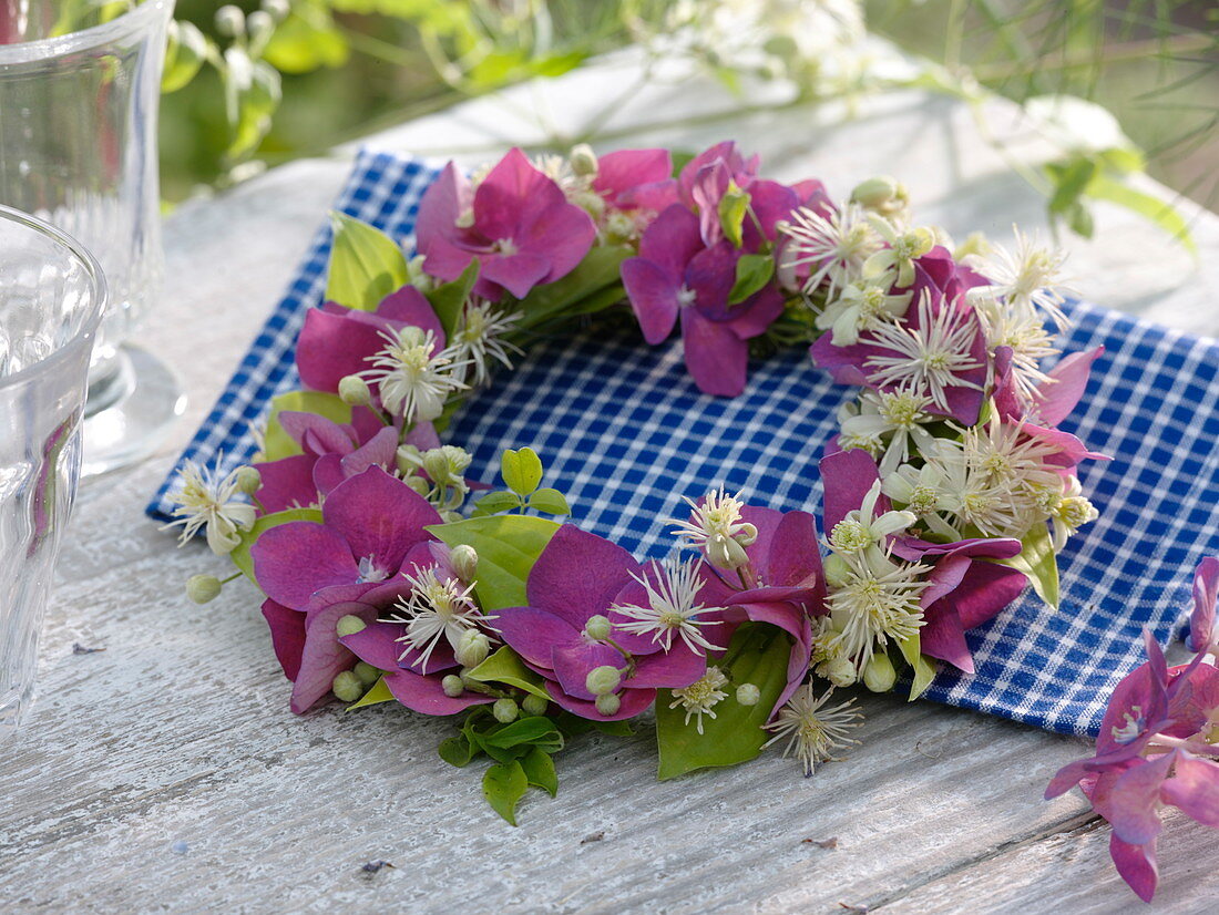 Small wreath of hydrangea (hydrangea) and clematis (clematis)