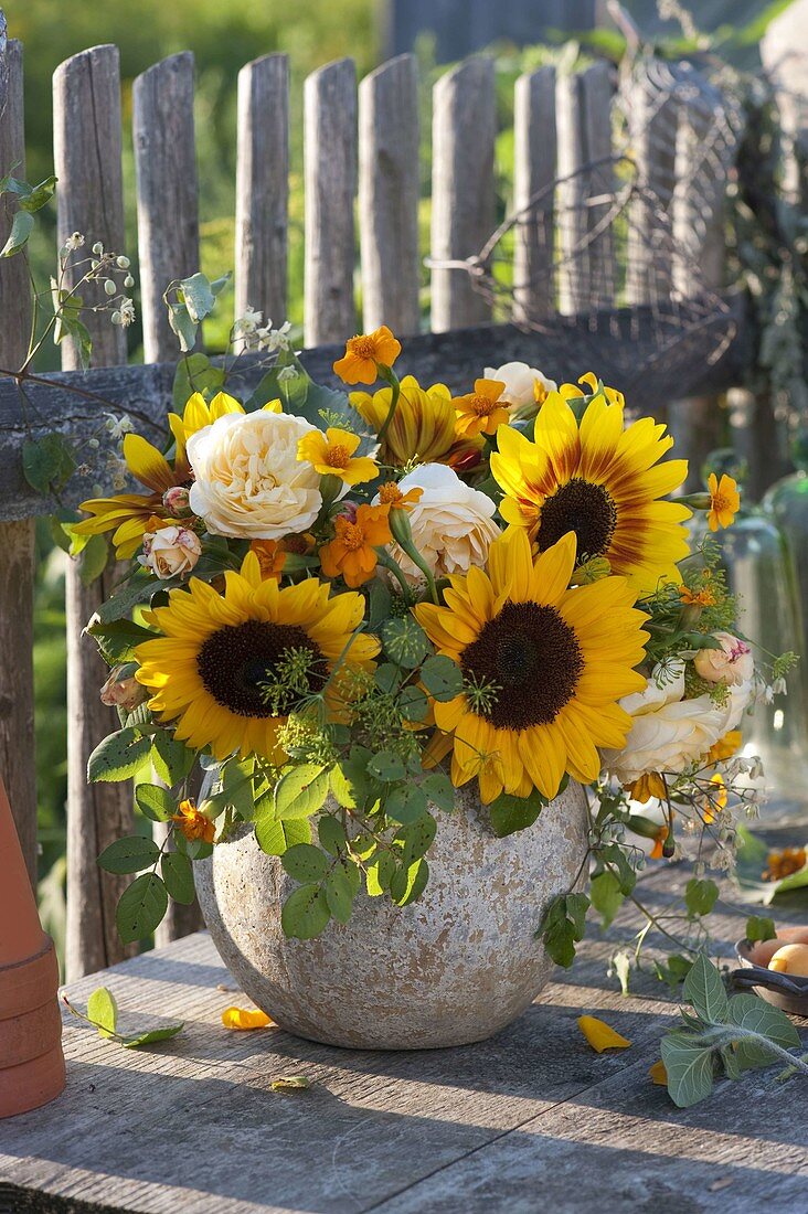 Yellow summer bouquet in ball vase