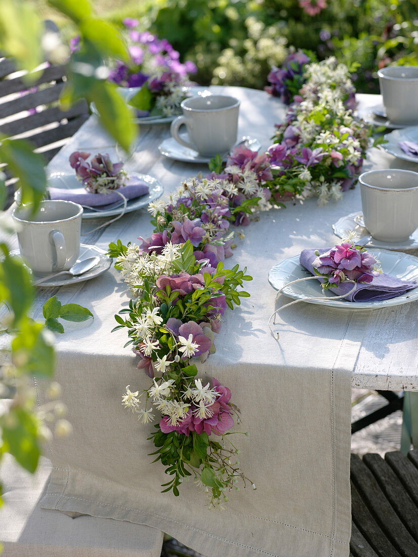 Late summer table decoration with blossom garland