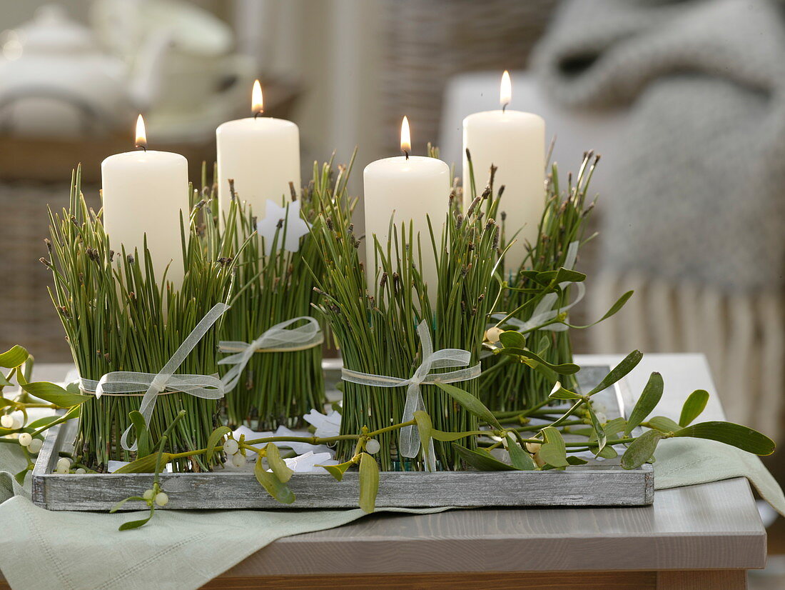 Unusual Advent wreath with candles wrapped in with Pinus