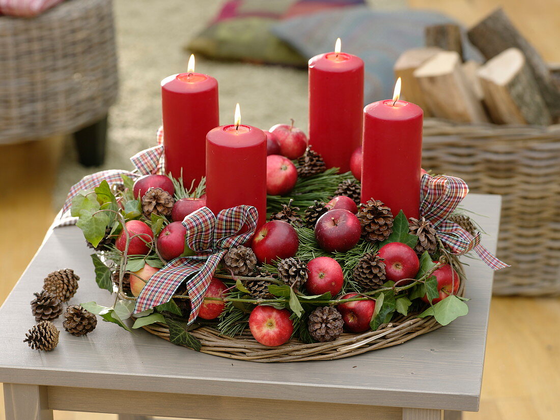Natural Advent wreath with apples, cones, hedera