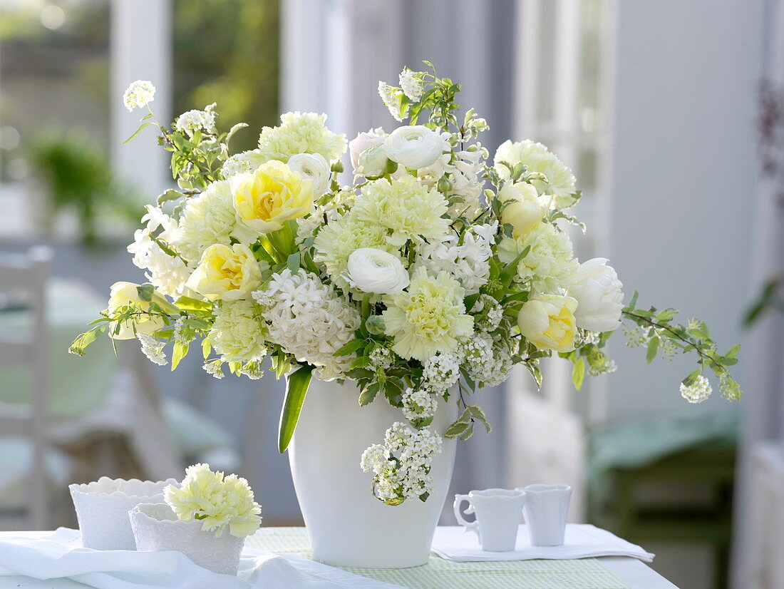 White-yellow bouquet with Dianthus (carnation), ranunculus