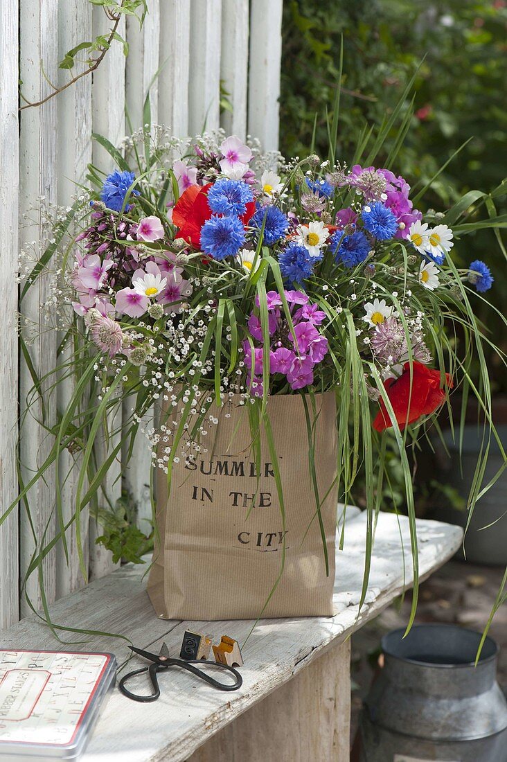 Summer bouquet in paper bag with 'Summer in the City' imprint