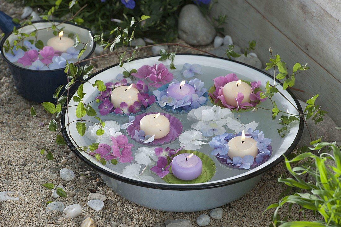Hydrangea flowers and candles on small baking cups